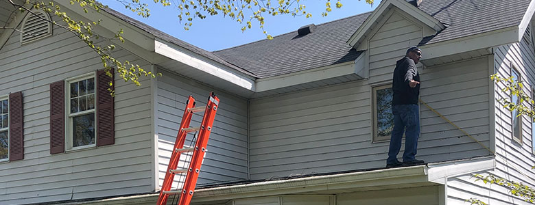 Isthmus Roofing Inspecting a Roof In Sun Prairie, Wisconsin